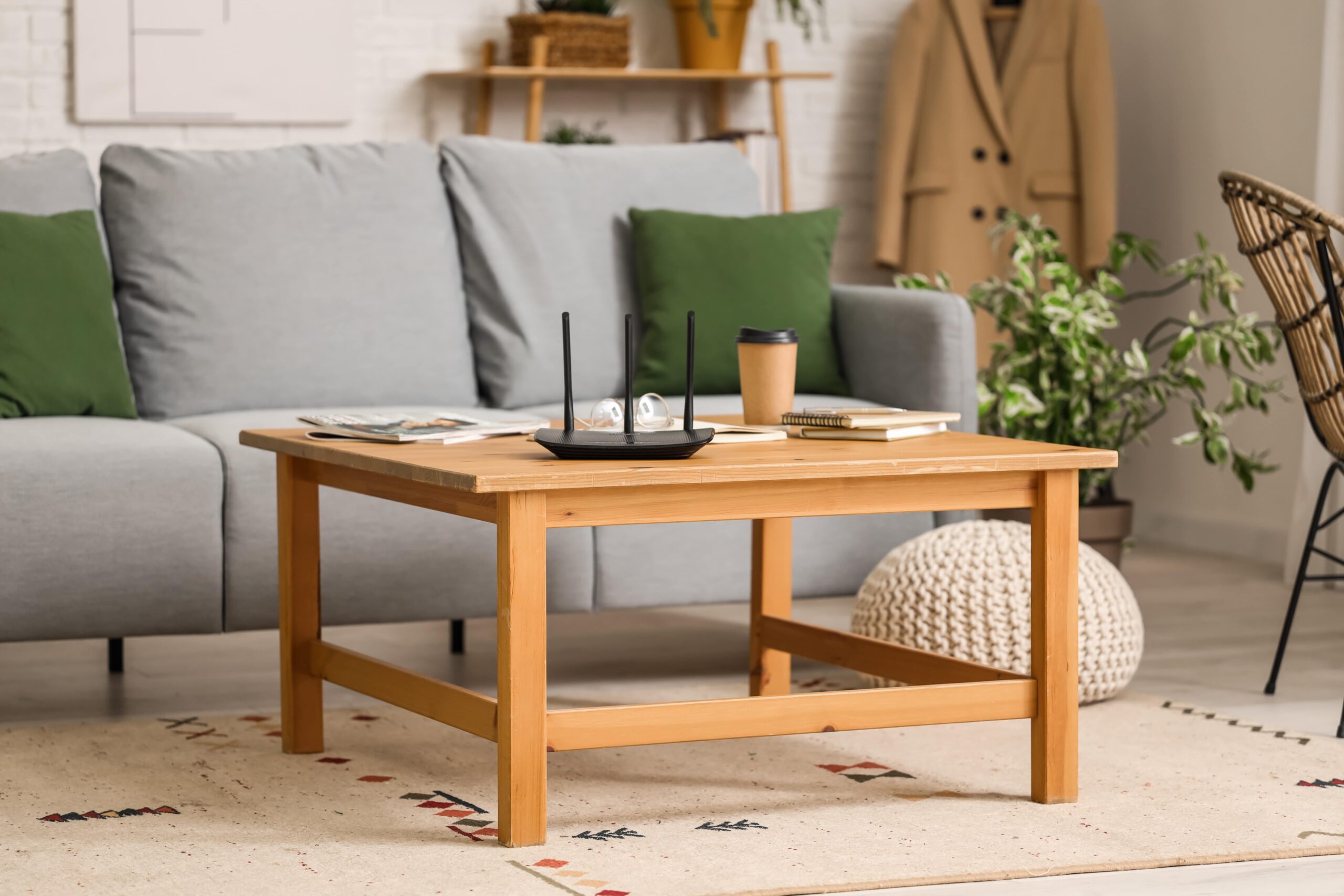 Cozy living room with a couch and a coffee table with a router placed on top