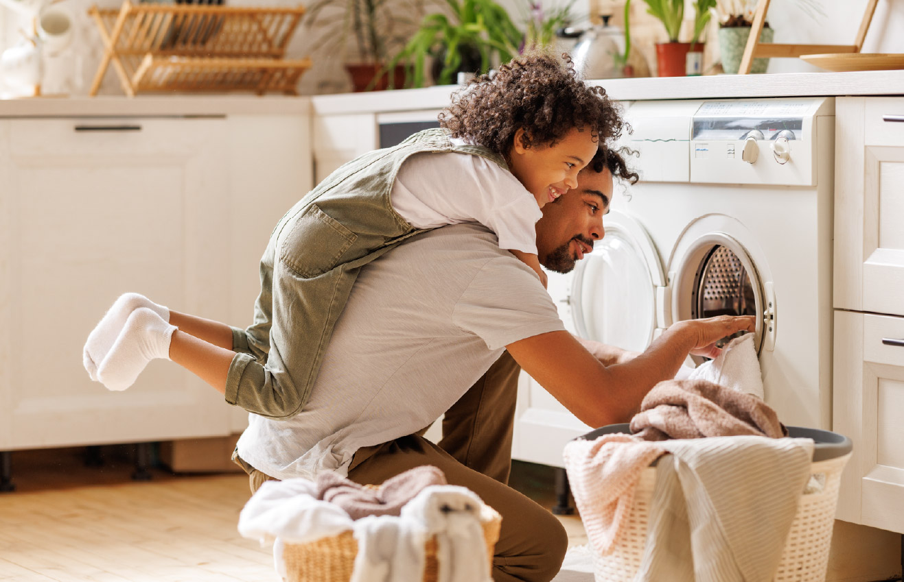 Father and son doing laundry