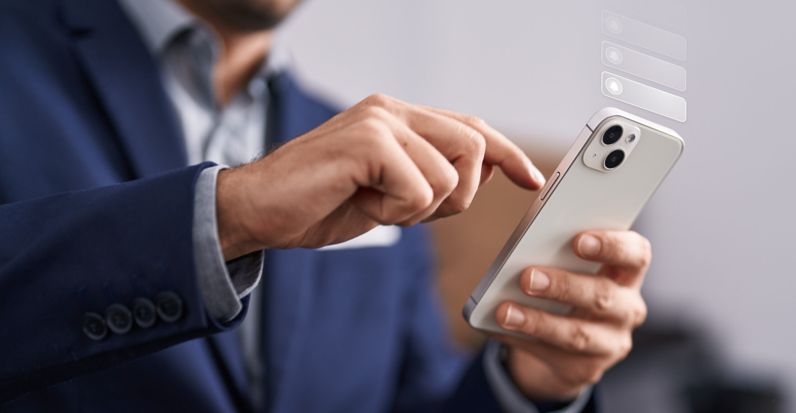 Man holding phone to interact with it. Overlay of numerous, incoming phone notifications